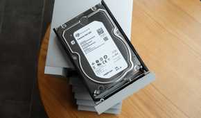 An enterprise hard drive with a wooden desk in the background