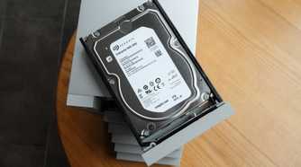 An enterprise hard drive with a wooden desk in the background