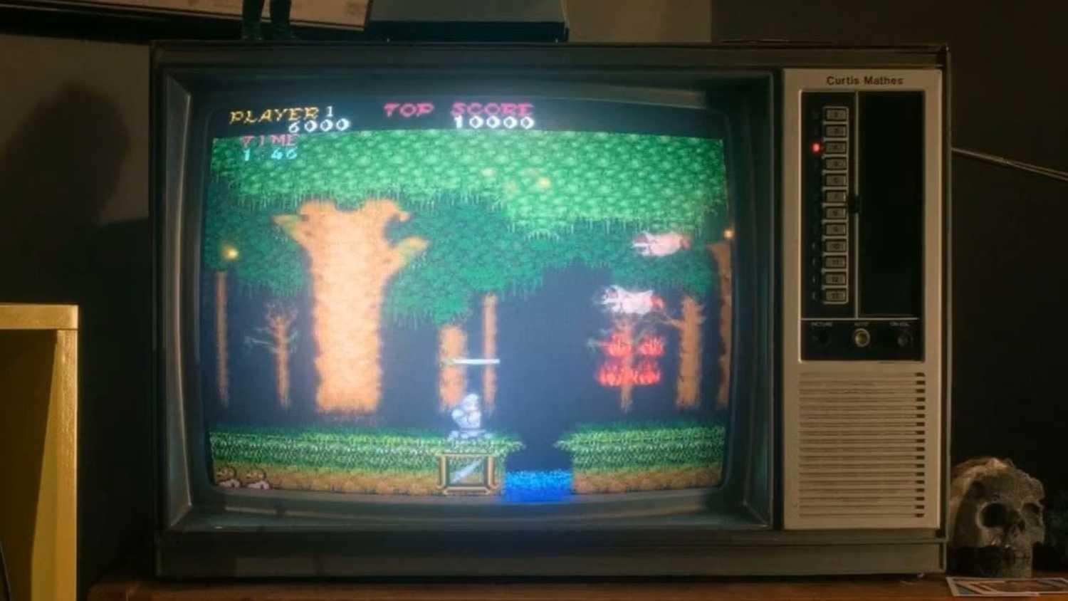 The arcade version of Ghost 'n Goblins wrongly playing on a NES connected to a TV in Stranger Things 5