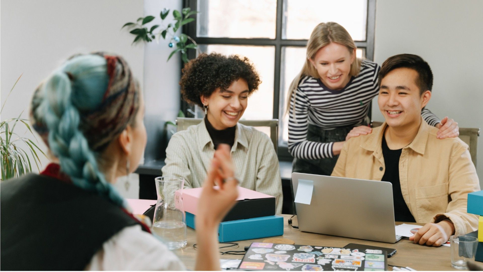 People staring at a laptop
