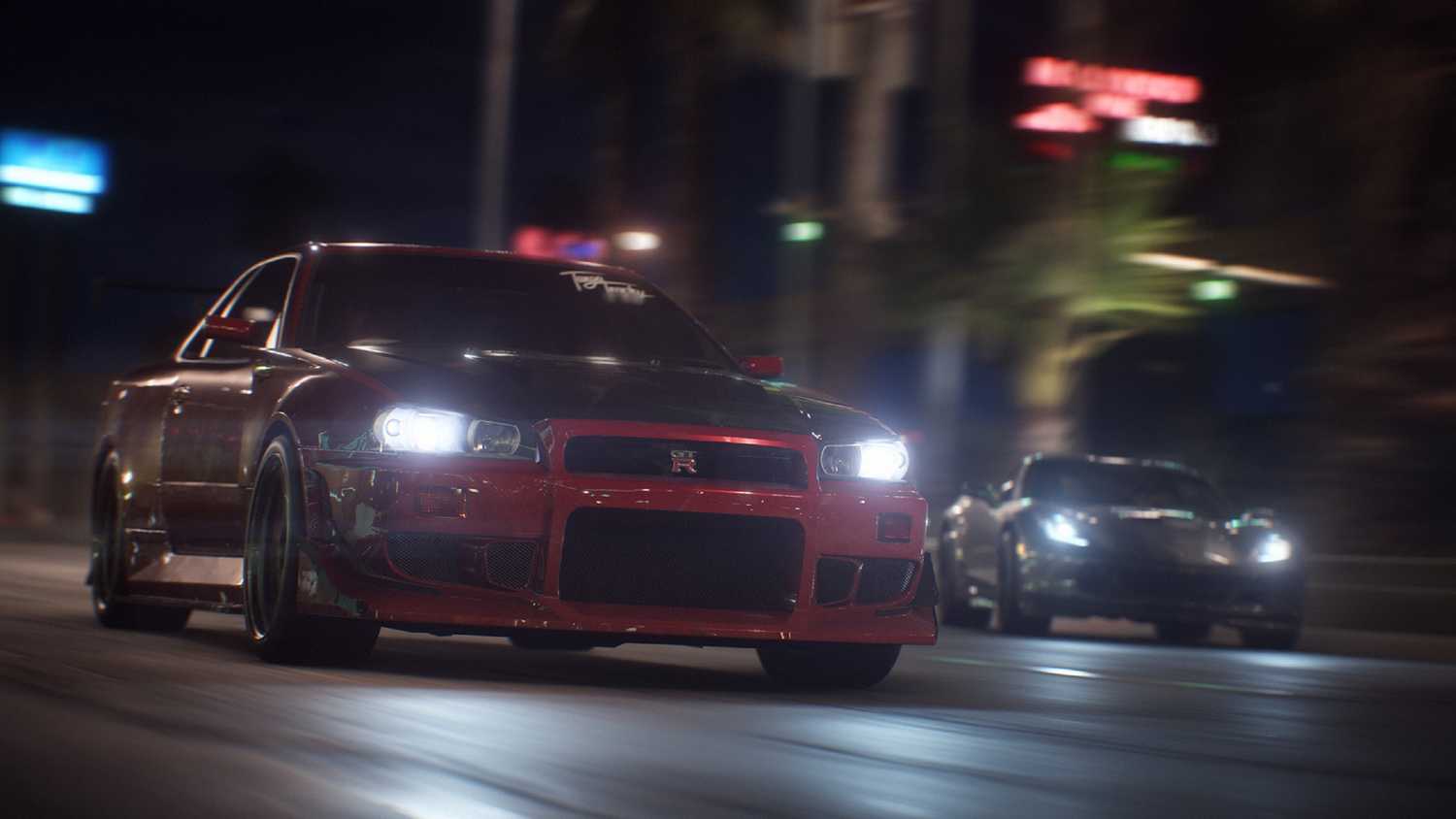 A red Nissan Skyline GT-R racing at night in NFS Payback.