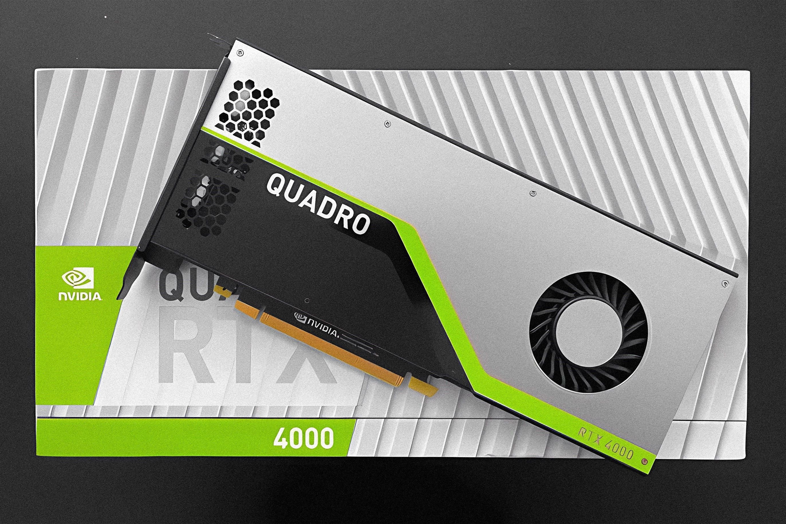 Nvidia Quadro graphics card placed on its box on a grey background