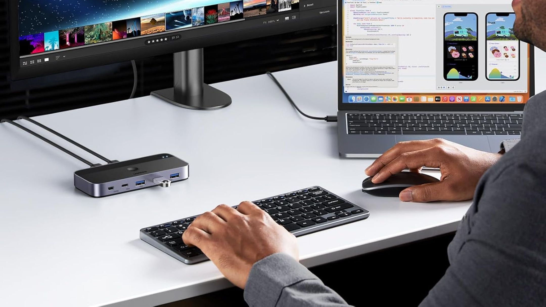 Person using UGREEN USB 3.0 Switch with desktop and laptop
