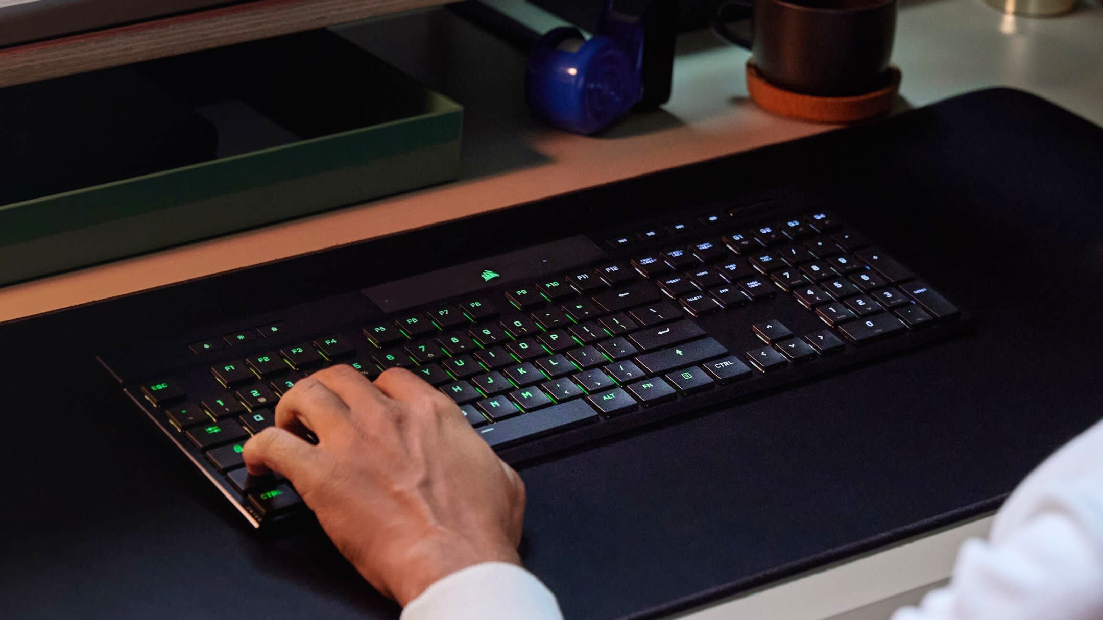 Person using Corsair K100 AIR on desk