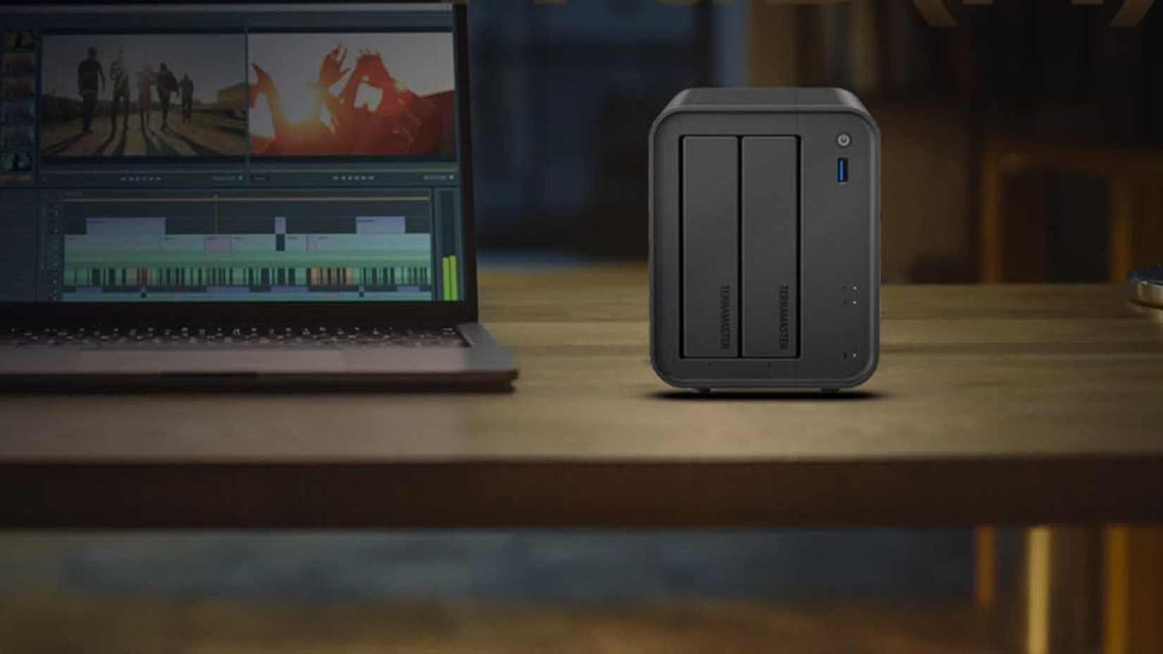 TERRAMASTER F2-425 2 bay NAS storage desk next to laptop