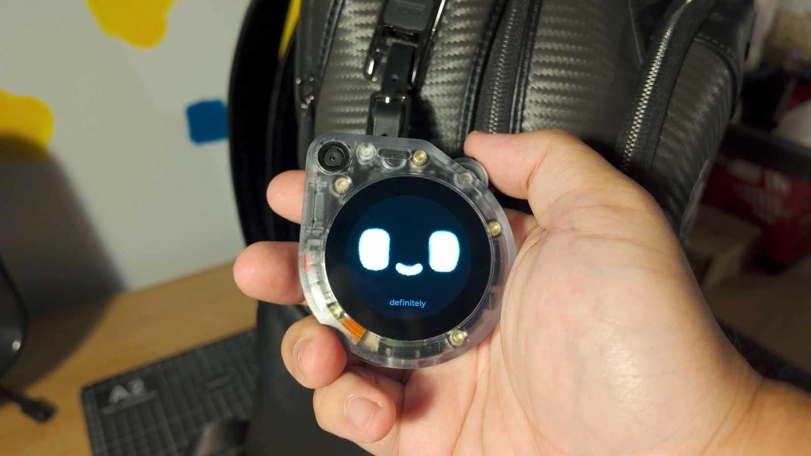 The Tamagotchi ESP32 in a backpack