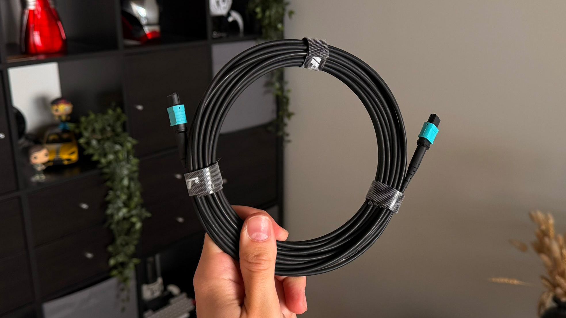 A Ruipro 8K HDMI cable being held 