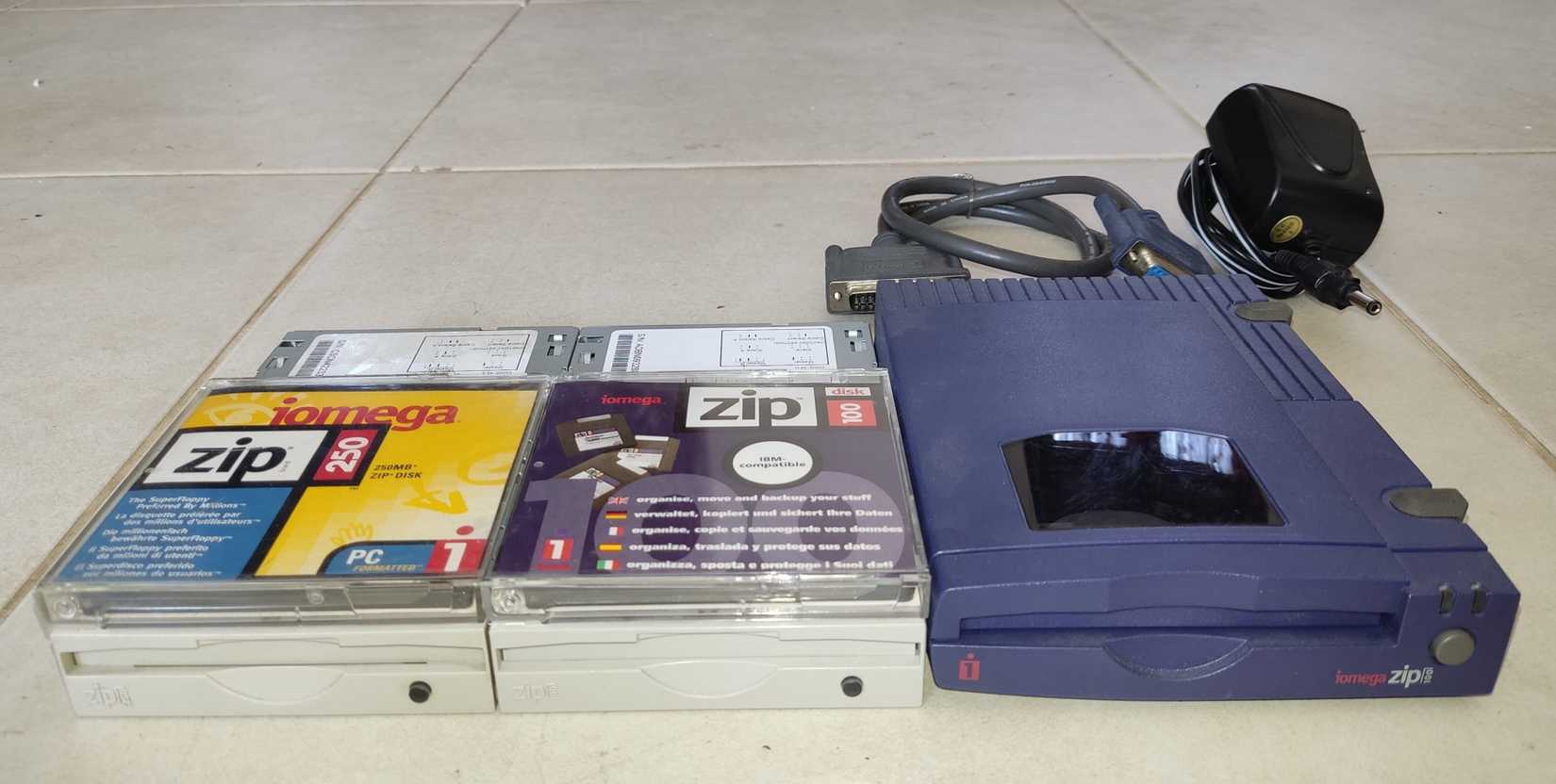 An external Zip 100 drive, an internal Zip 100 drive with a disk, and an internal Zip 250 drive with a disk