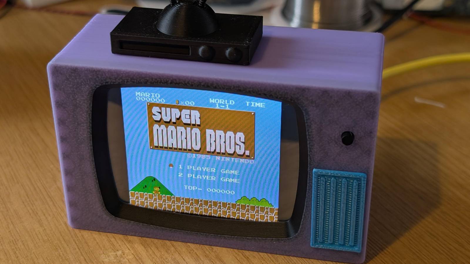 Someone built a Simpsons-style retro TV that plays NES games and 90-minute movies on a tiny display