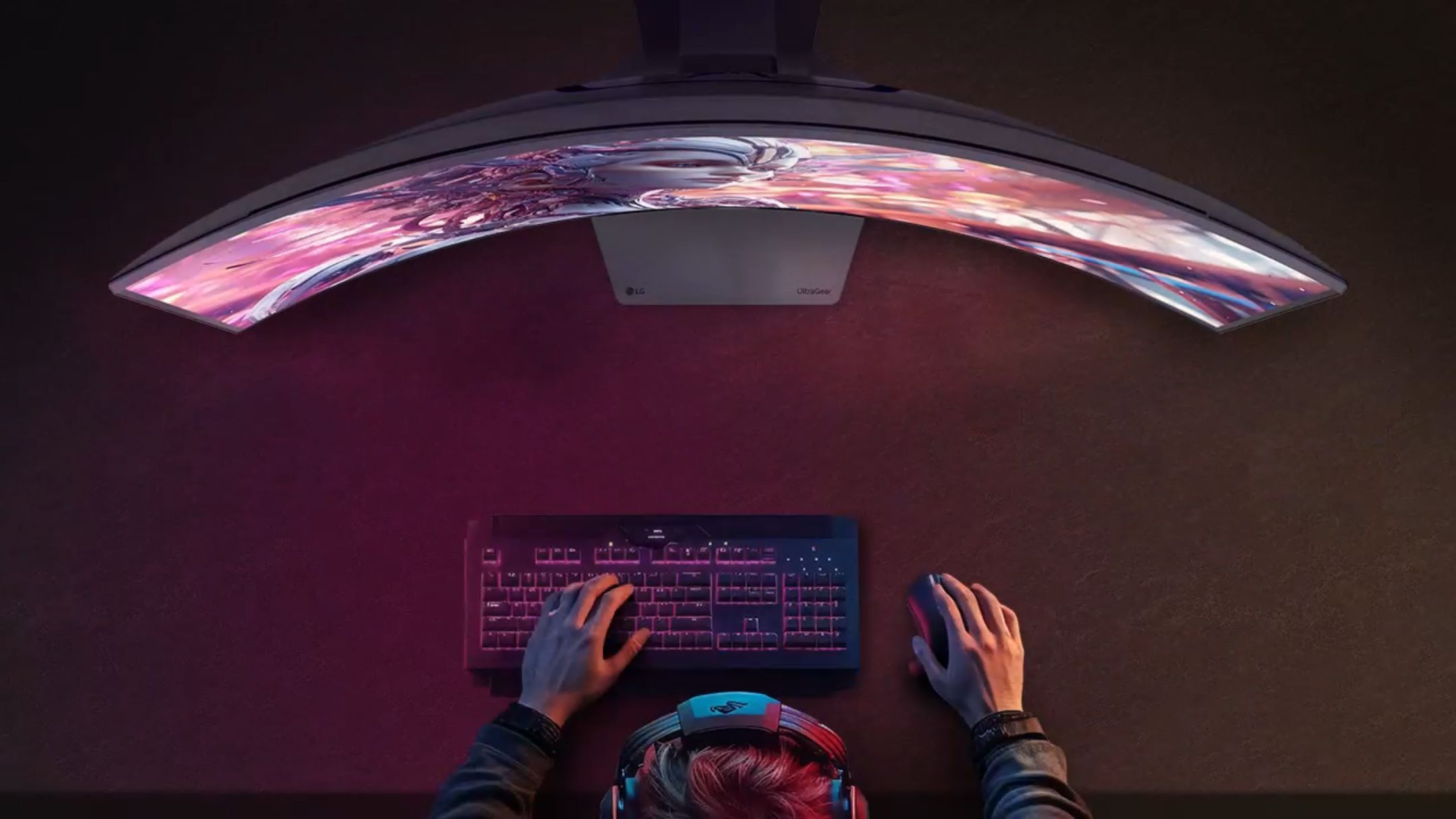 Person in front of LG 34GX900A-B ultragear monitor