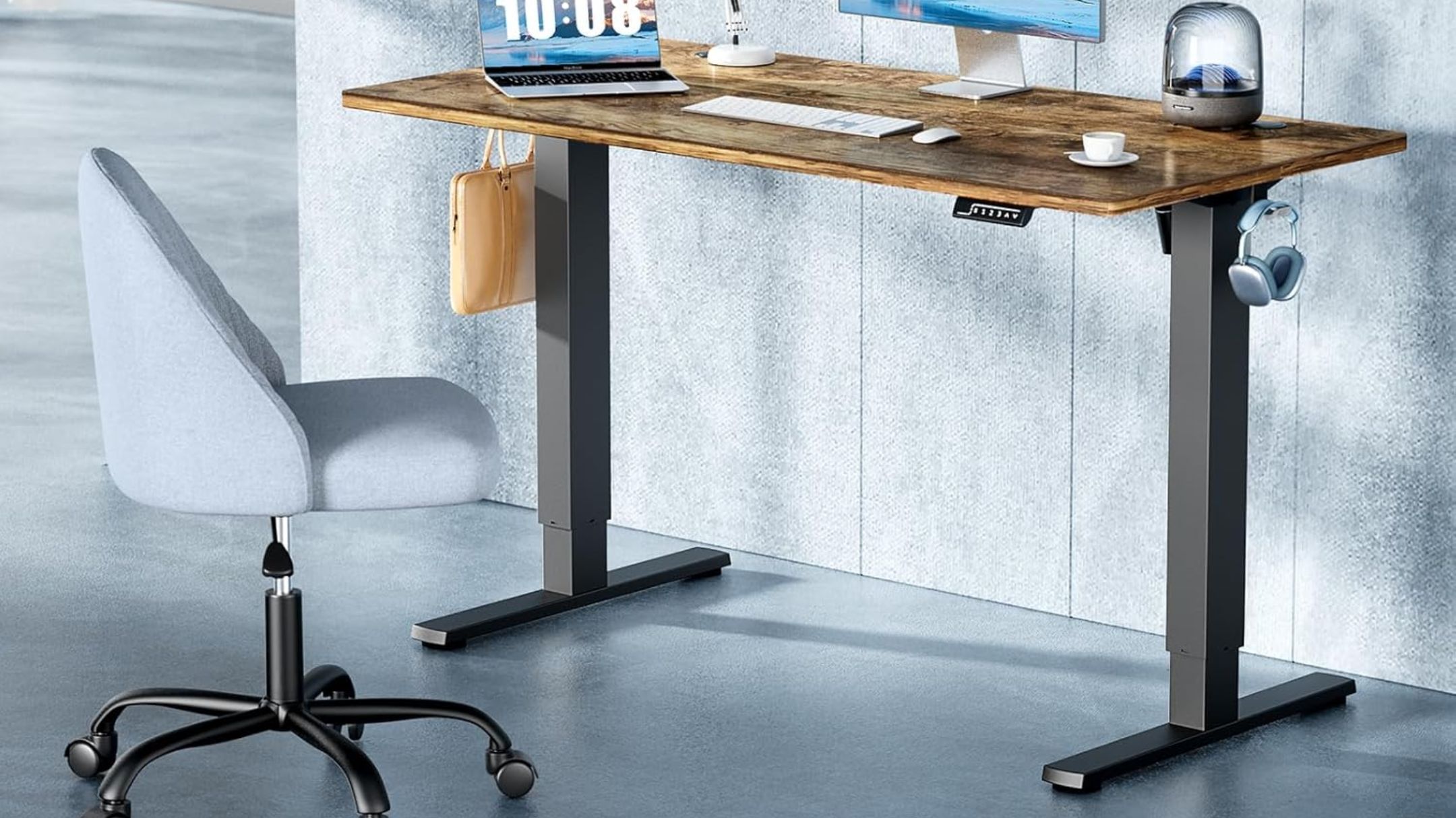 DUMOS 63 Inch Electric Standing Desk in an office with laptop and monitor on desk