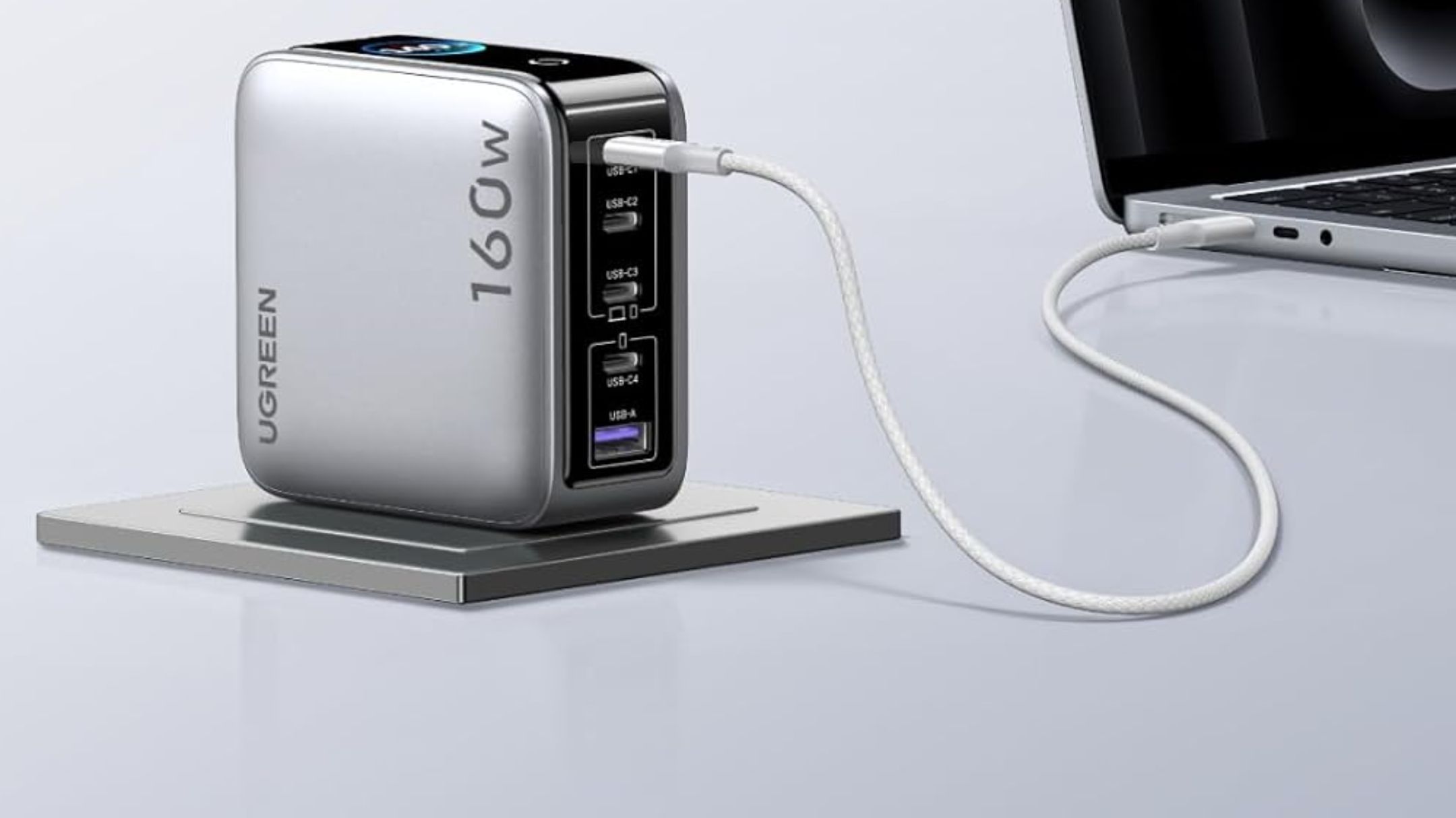 UGREEN Nexode Pro Charger plugged into a laptop