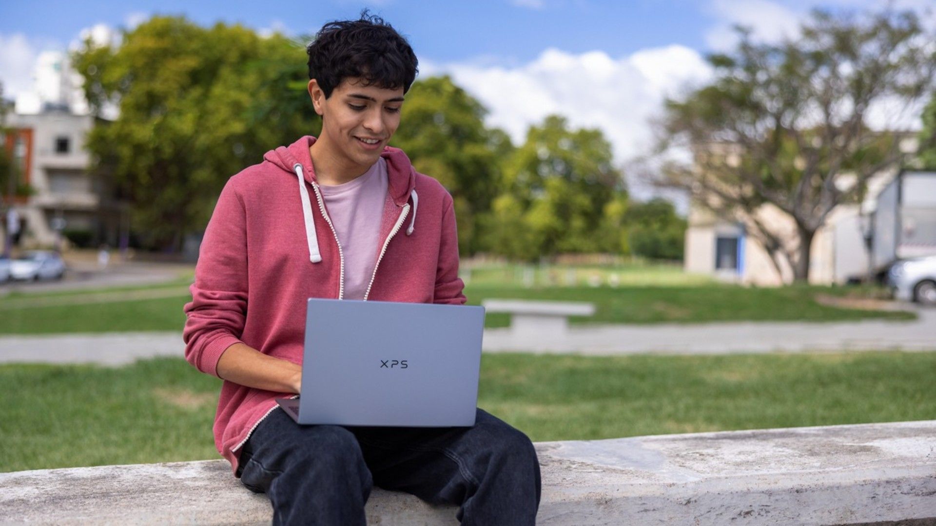 Boy using a Dell XPS laptop