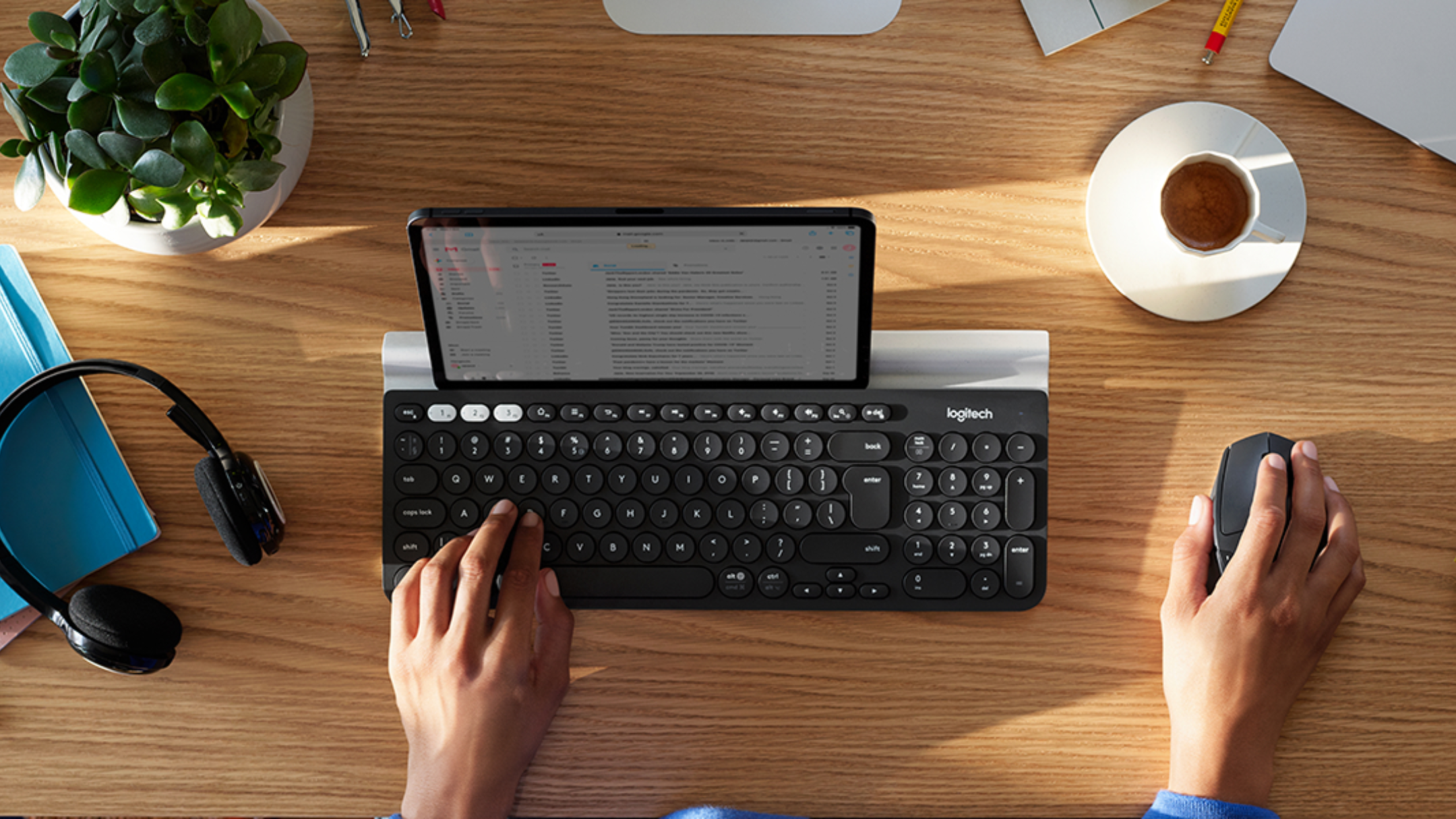 Person using Logitech M720 Triathalon Full Size Multi-Device Wireless Mouse 