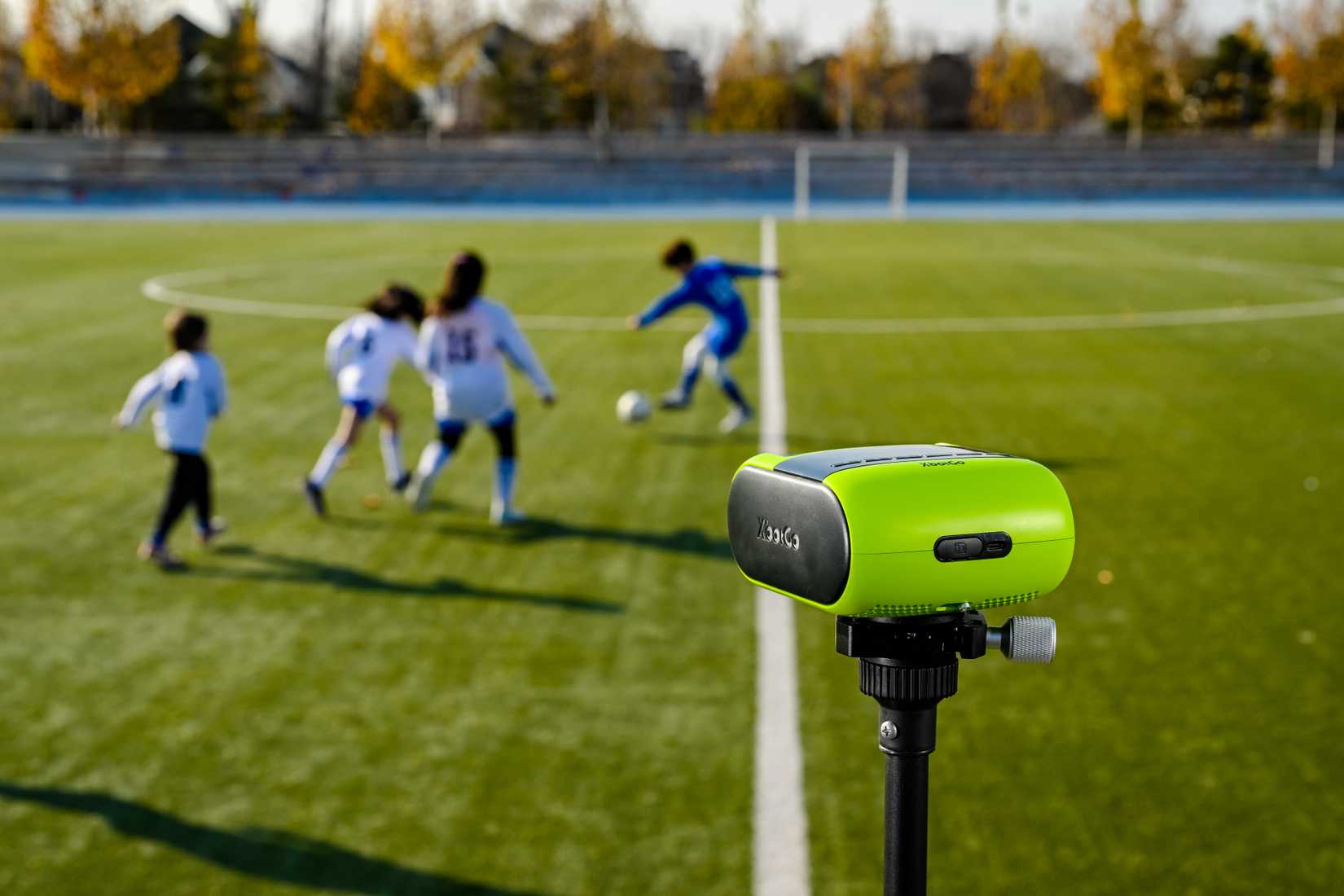Closeup rear view of the XbotGo Falcon camera filming a soccer game.