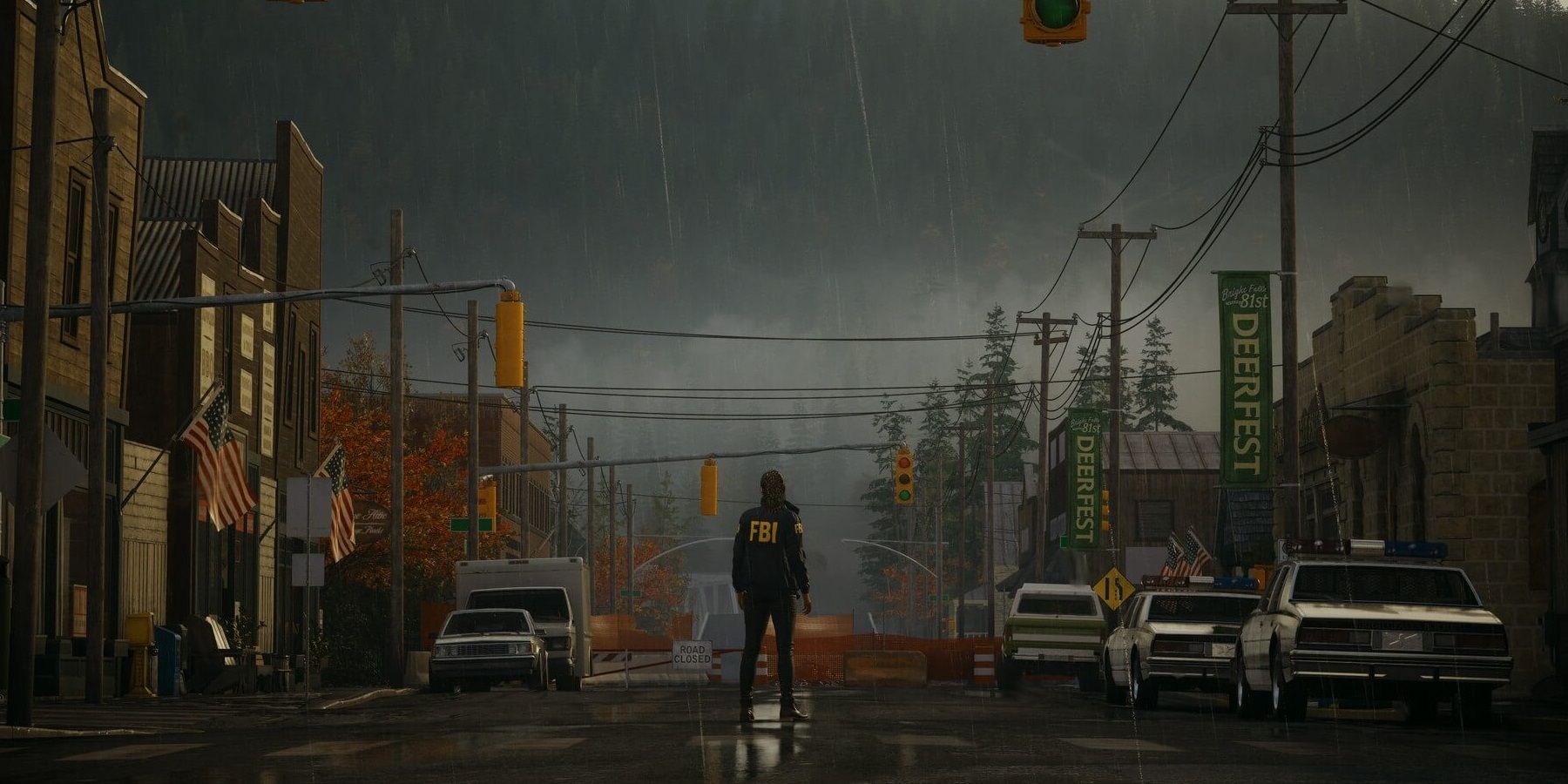 Alan Wake standing in the middle of a road in Bright Falls
