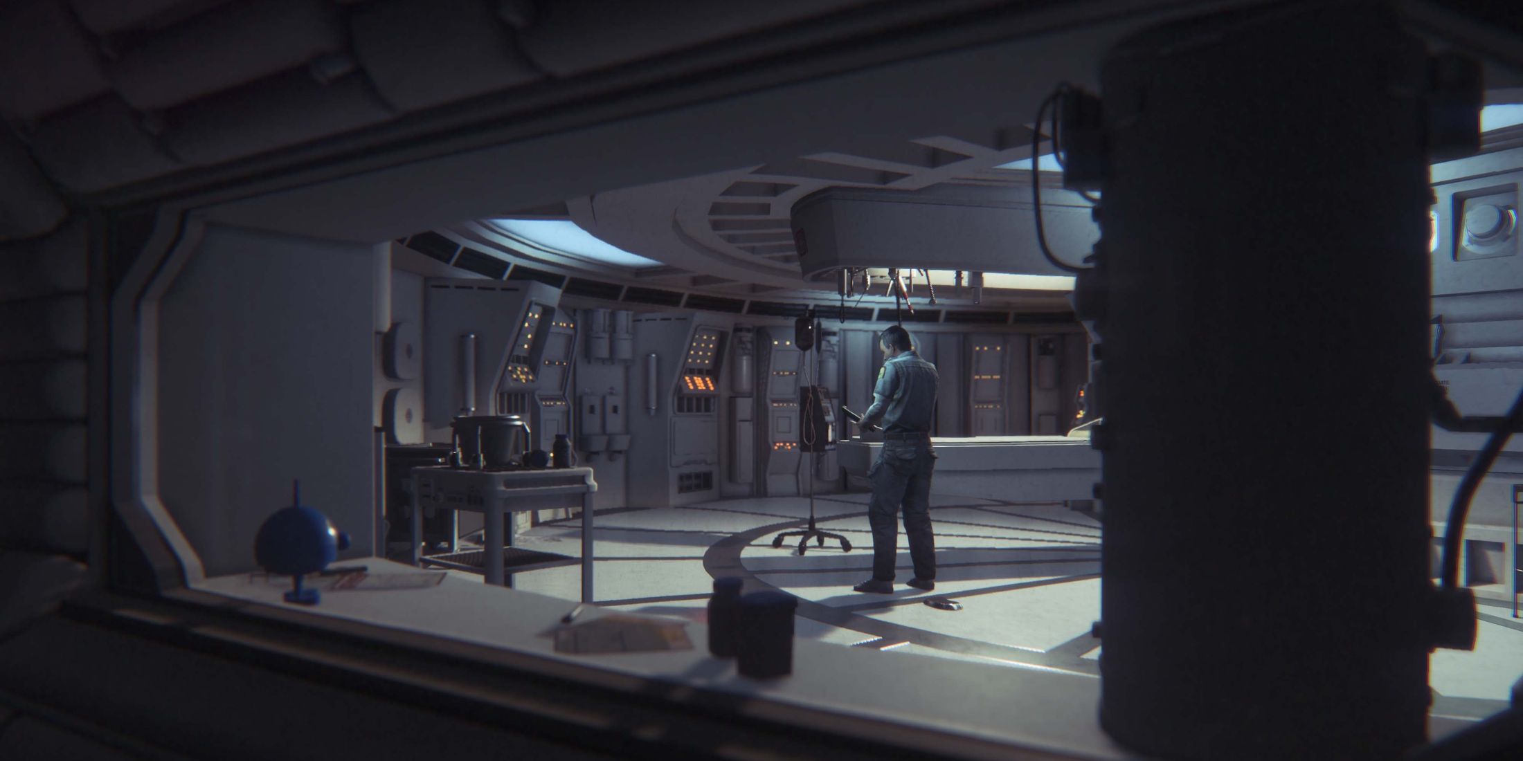A man standing in the middle of a room in a space ship