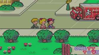Screenshot from Earthbound video game of three characters walking on the sidewalk as a truck passes by