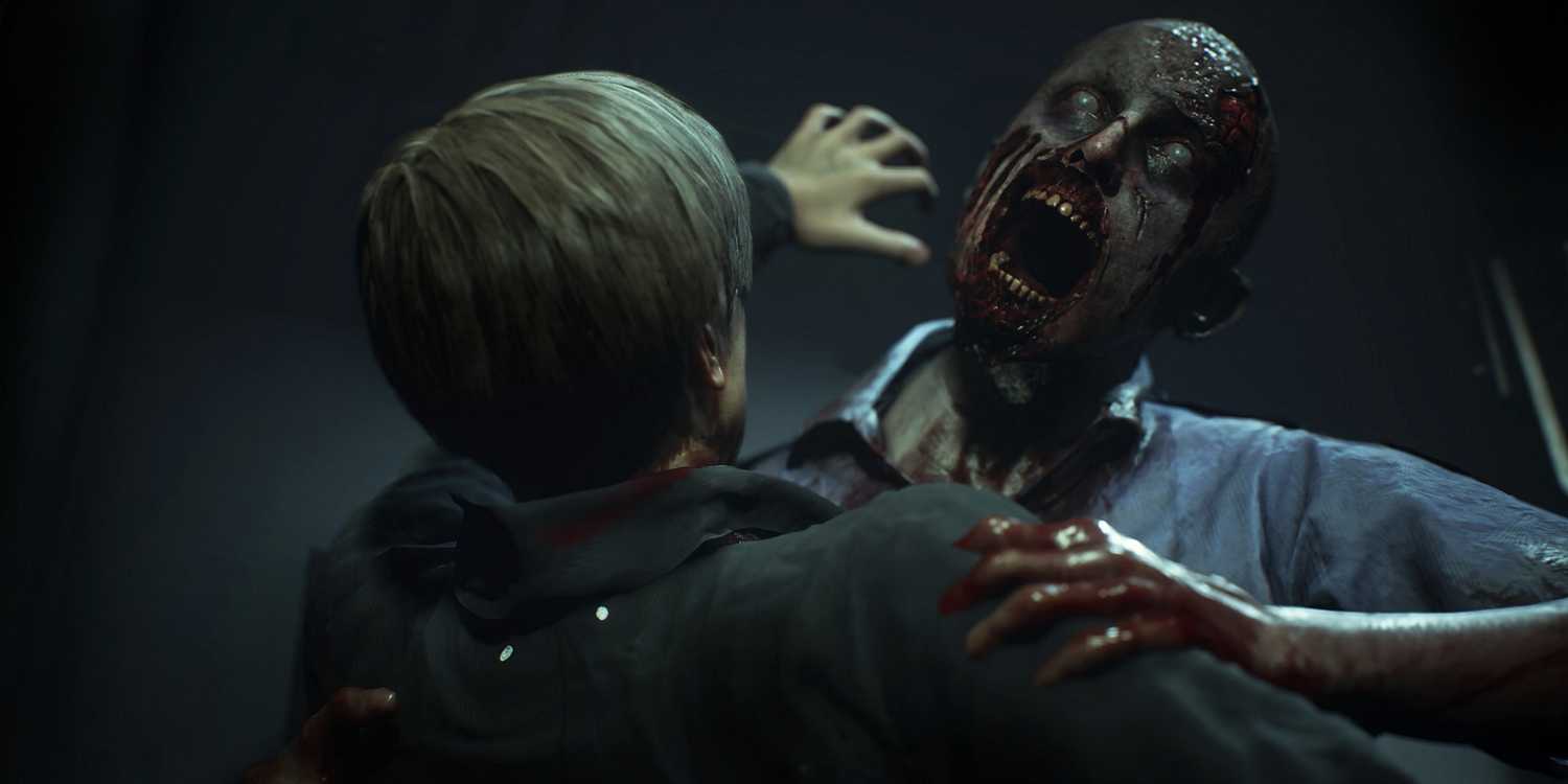 Leon being attacked by a zombie in Resident Evil 2 remake-