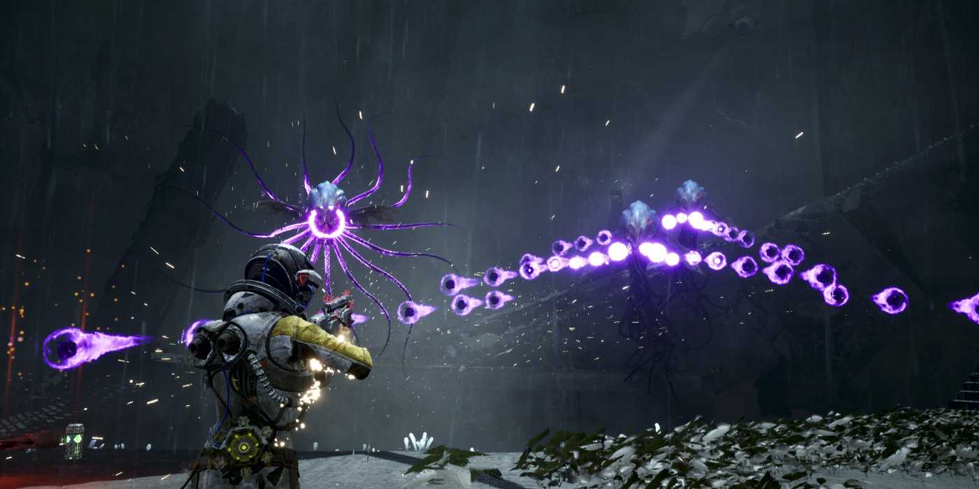 Screenshot from Returnal video game of Selene fighting squid-like alien creatures who are firing damaging energy orbs at her.