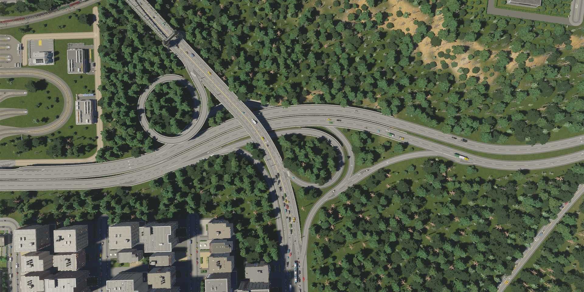 A large highway going through a forest