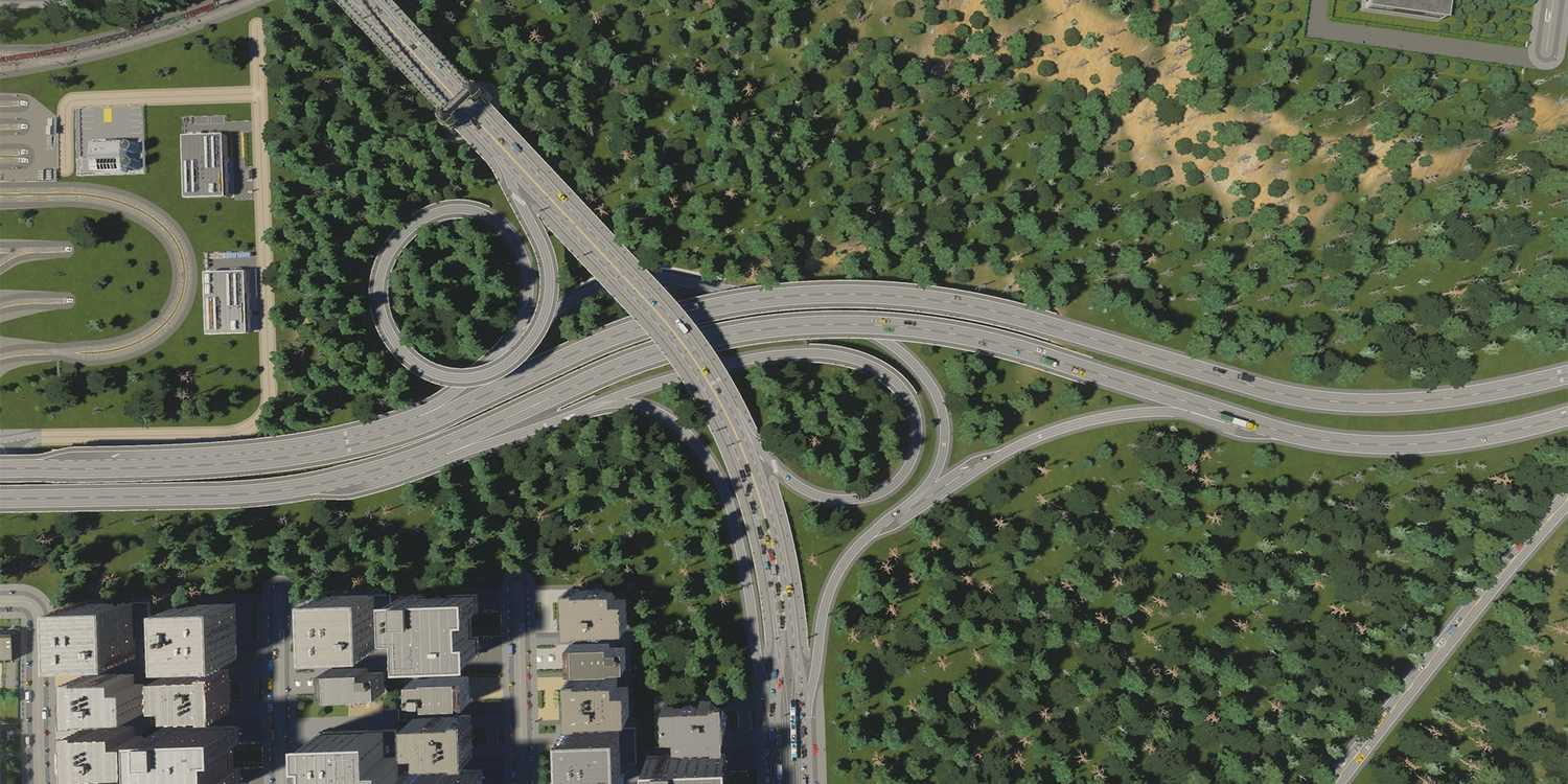 A large highway going through a forest