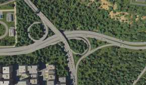 A large highway going through a forest