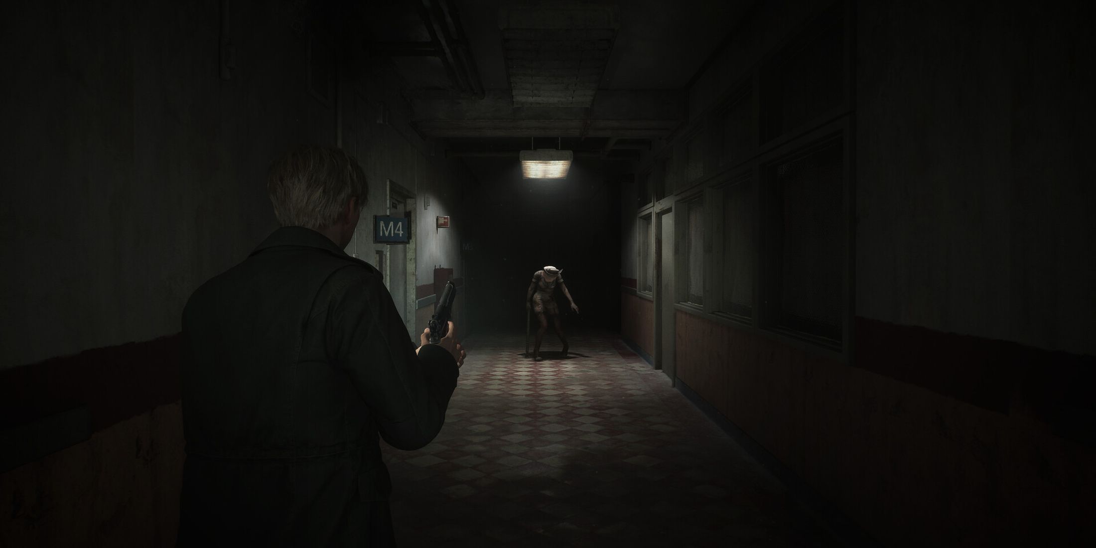 James fighting a nurse in a corridor