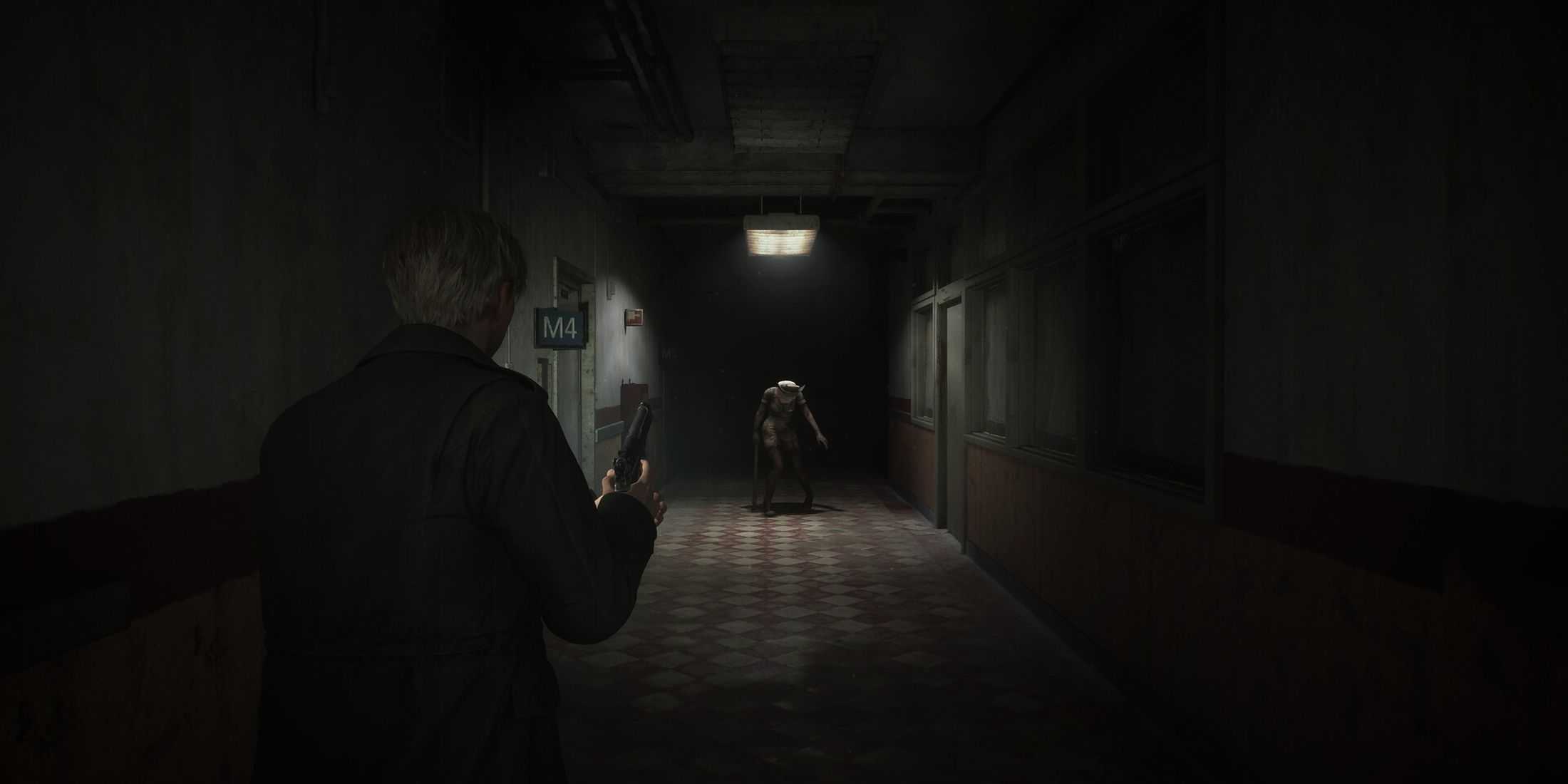 James fighting a nurse in a corridor