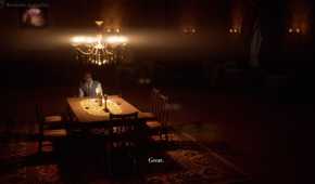 A man sitting alone at a dinner table with a lit chandelier above him