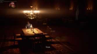 A man sitting alone at a dinner table with a lit chandelier above him