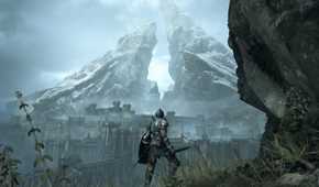 demon souls overlooking a castle with a big mountain behind it