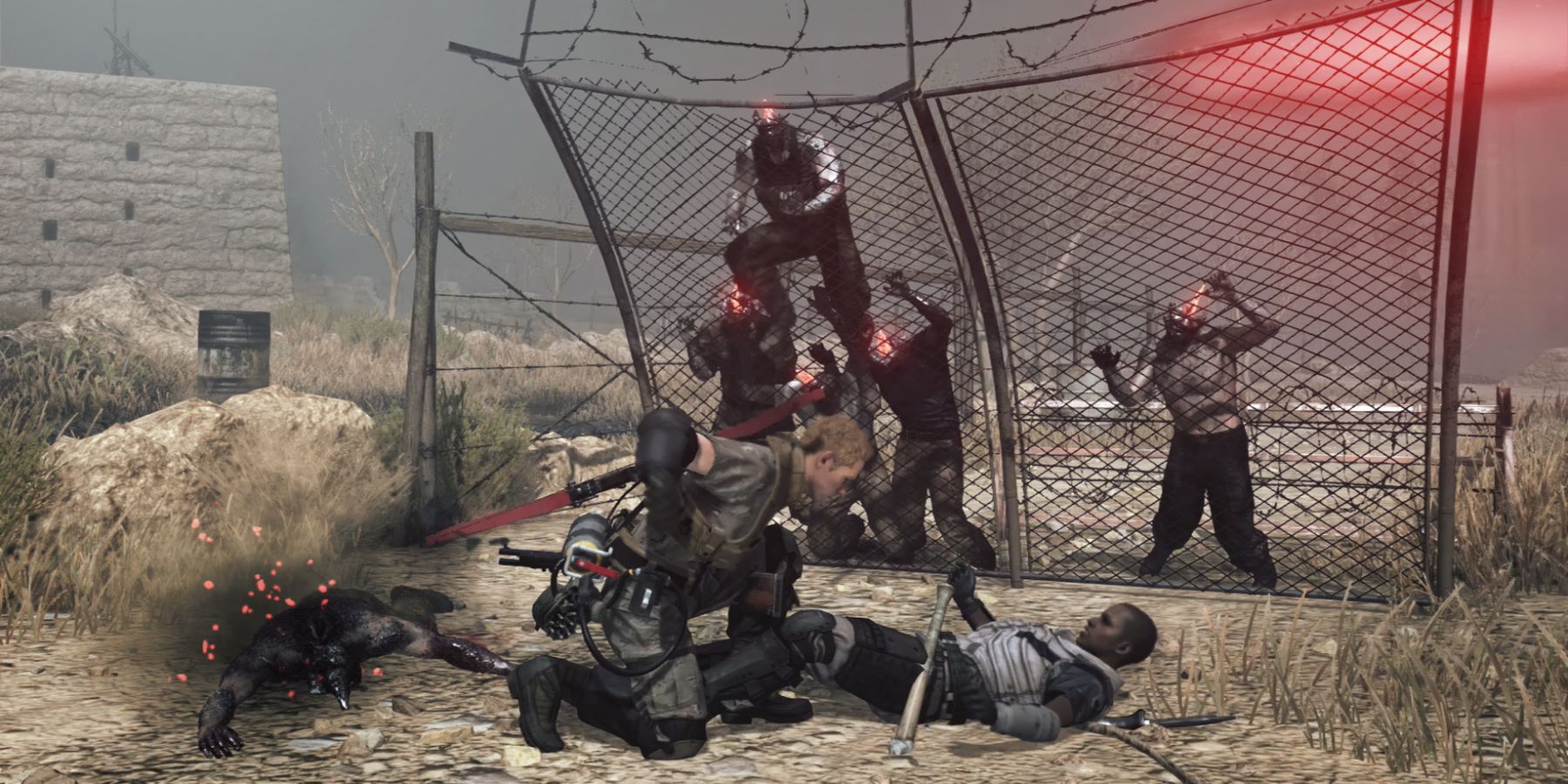 Zombies climbing over a fence