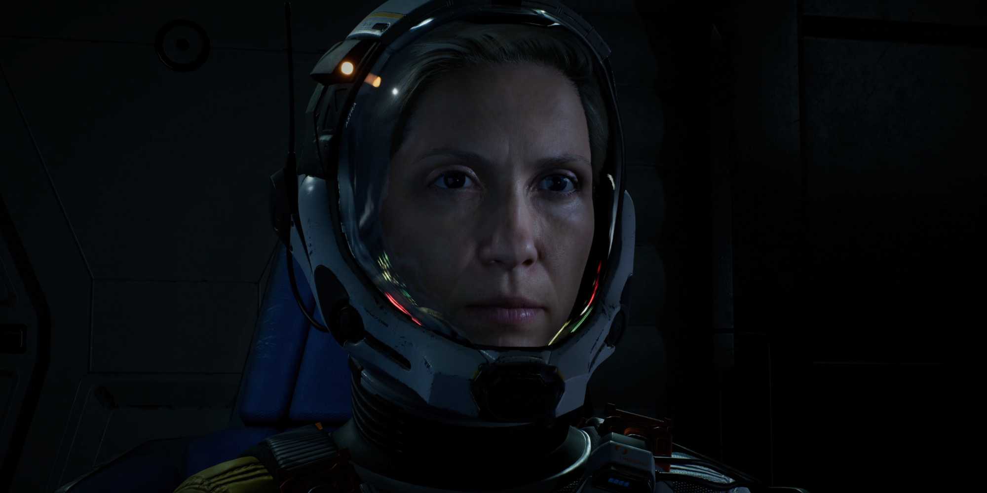 Screenshot from Returnal video game of main character Selene in space suit.