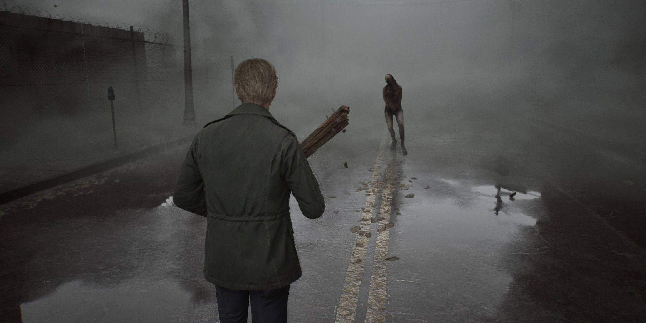 James fighting a monster on a foggy street