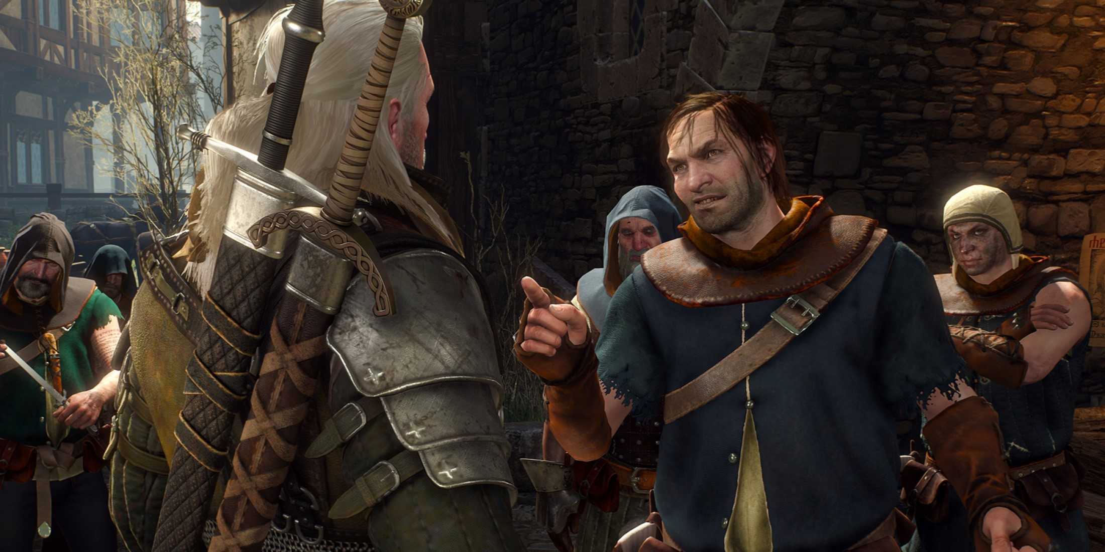 Geralt facing an angry mob of villagers