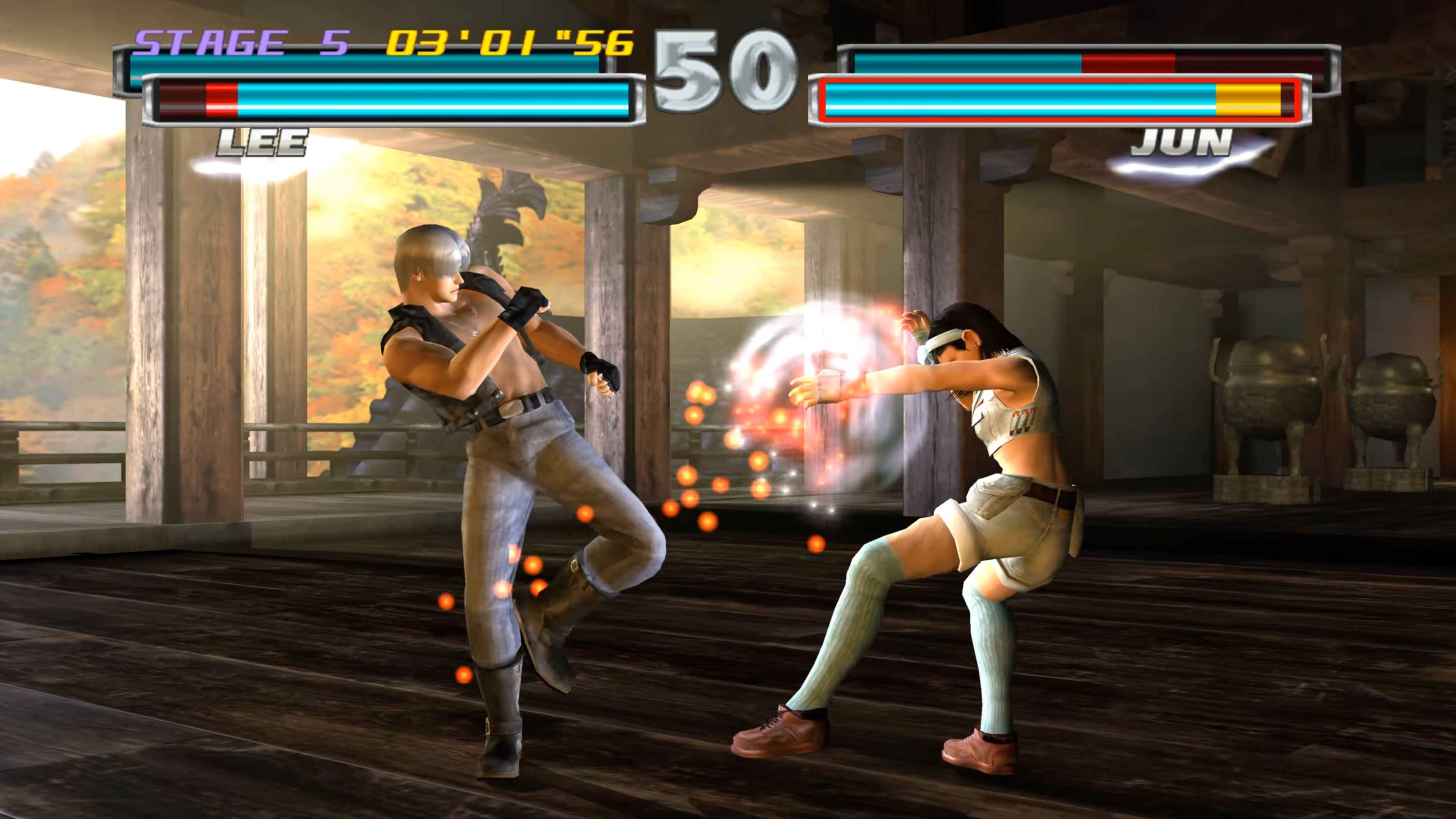 A screenshot of Lee and Jun in a match in Tekken Tag Tournament