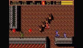 ninja gaiden 2 ryu platforming in front of a brick wall