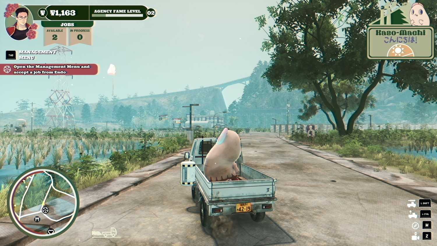 promise mascot agency pinky riding in the back of the truck