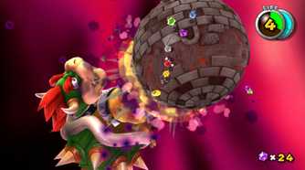 A screenshot of Mario battling a giant Bowser in Super Mario Galaxy + Super Mario Galaxy 2