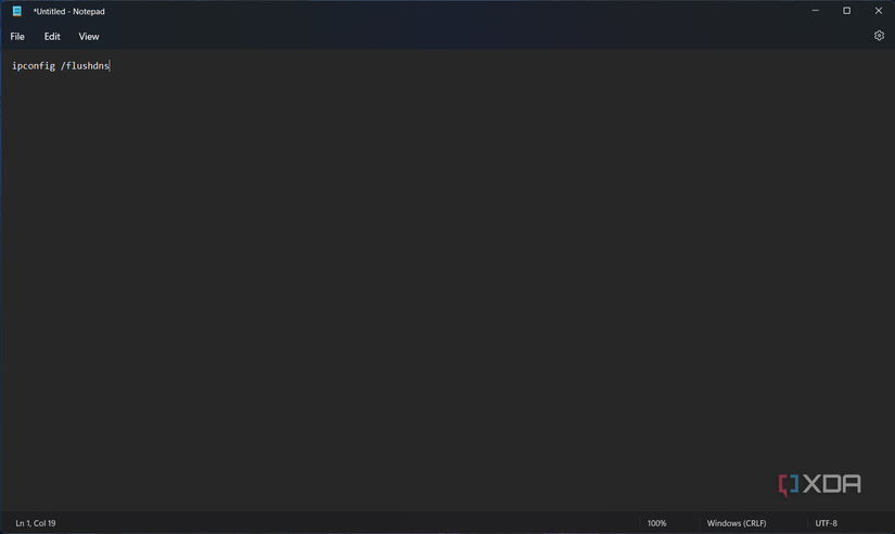 Screenshot of Notepad with a command for clearing the DNS cache in Windows 11