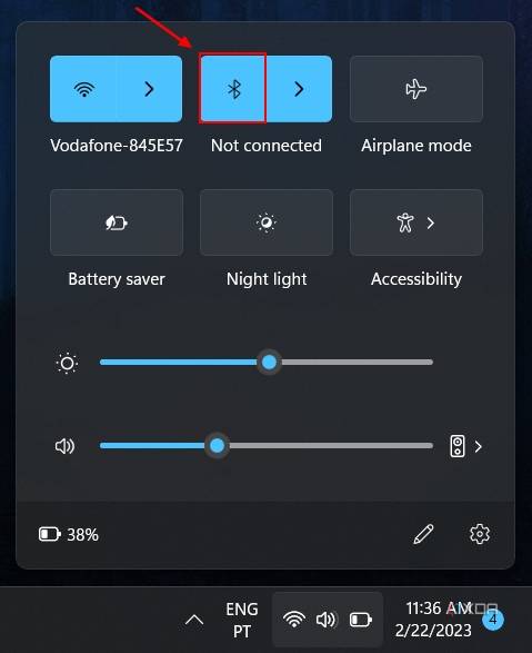 Screenshot of the Windows 11 Quick Settings panel showing how to turn on Bluetooth
