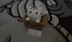 An image showing an artisan keycap of a cat in a box.