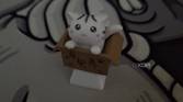 An image showing an artisan keycap of a cat in a box.