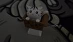 An image showing an artisan keycap of a cat in a box in dark.