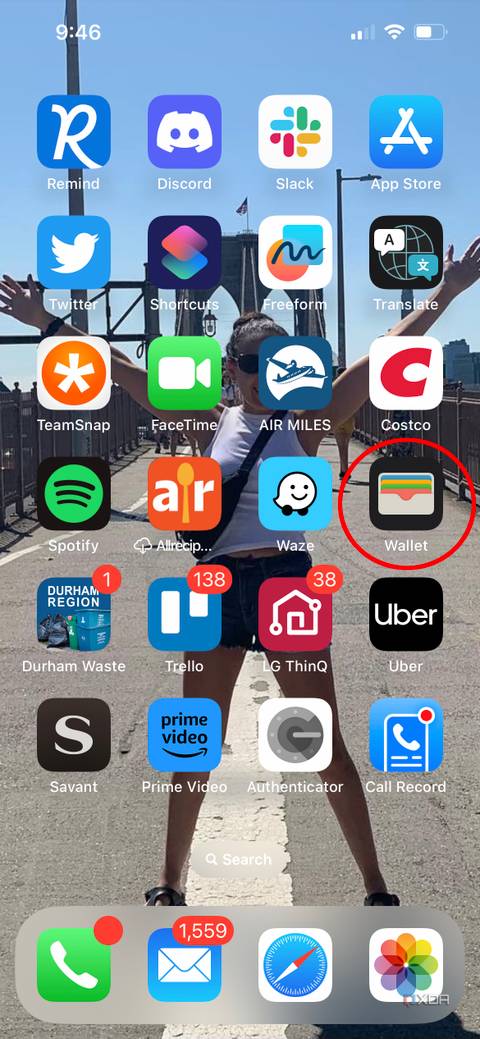 An iPhone home screen with Apple Wallet highlighted.