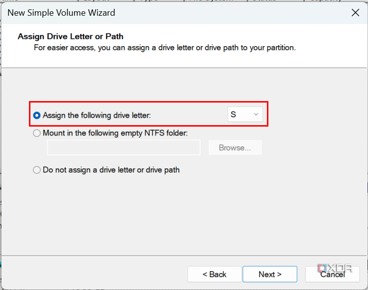Screenshot of the New Volume Wizard showing drive letter S assigned to the drive being created