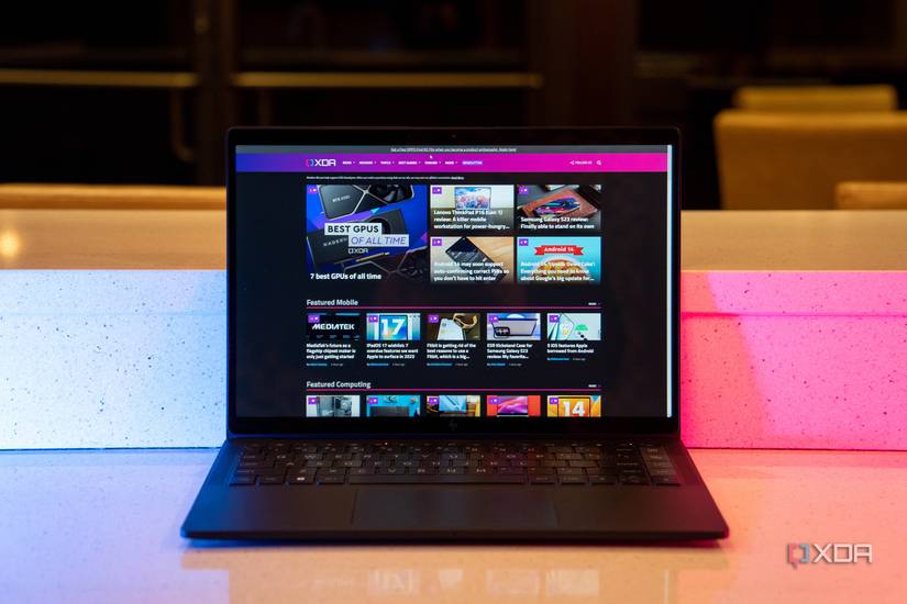 Black laptop showing XDA homepage
