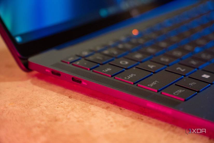 Angled view of two USB Type-C ports on a black laptop