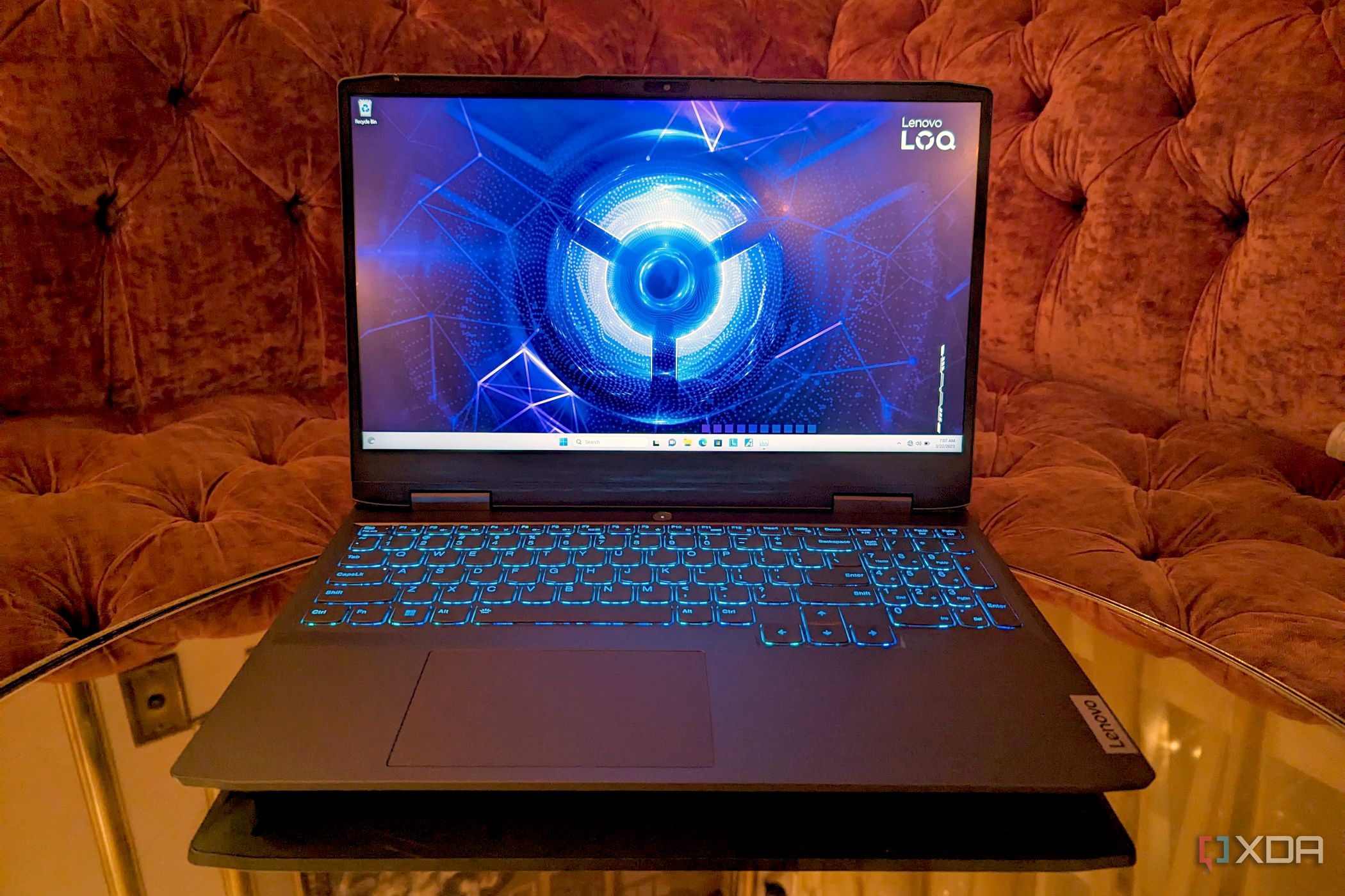 Lenovo LOQ 15 Gaming Laptop on a table in front of a sofa